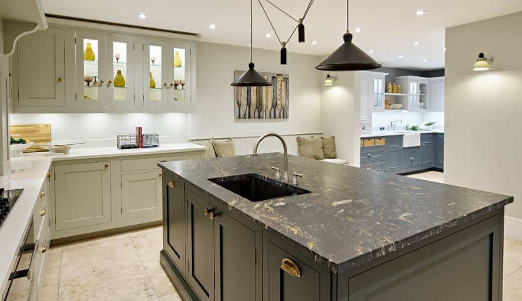 Large, deep single-bowl sink in a kitchen island.