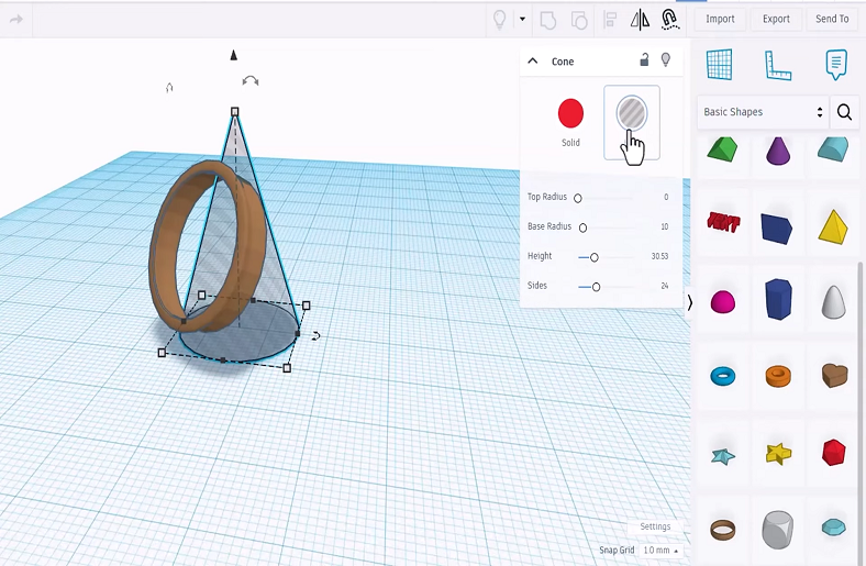 A cone and ring being designed in Tinkercad.






