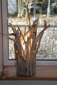 Denne inneholder et bilde av 40+ Creative Decorating Ideas with Branches to Bring Nature into Your Home