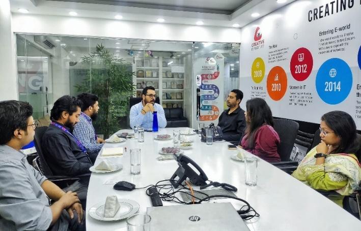 May be an image of 6 people, people studying, newsroom and text