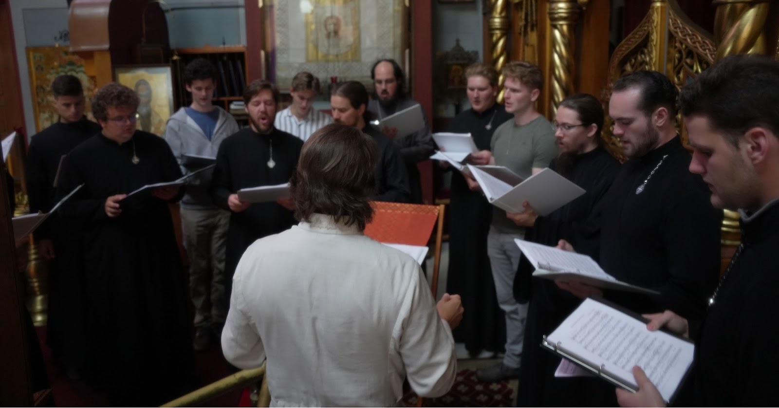 Nicholas Kotar conducting a choir