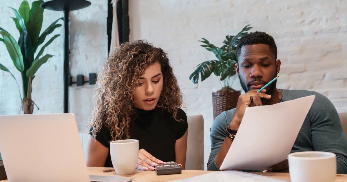 (couple reviewing their finances)