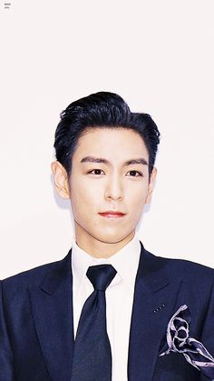 This contains an image of Former BIGBANG member TOP