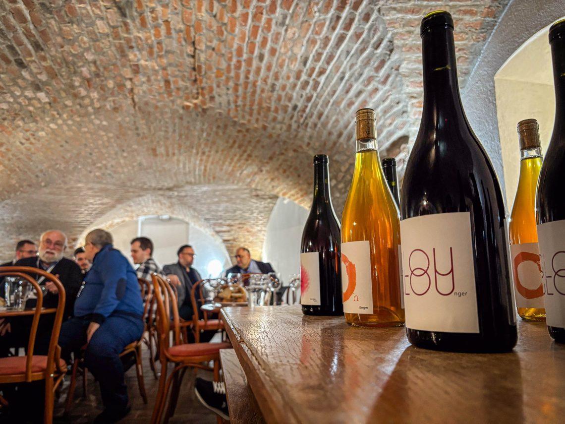 A group of wine bottles on a table

AI-generated content may be incorrect.