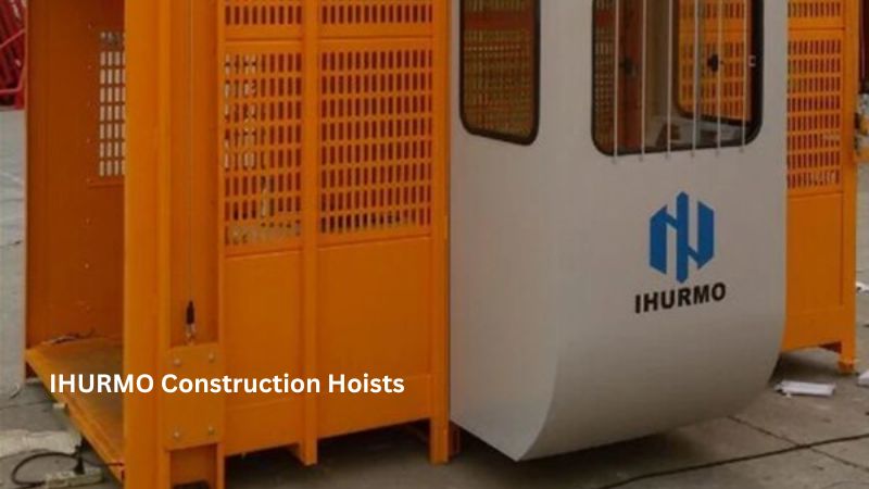 Orange IHURMO construction hoist with a logo on its white panel.