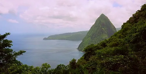 Hikers on trail with view of St Lucia's famous Piton mountains