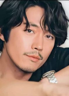 This contains an image of Jang Hyuk 
