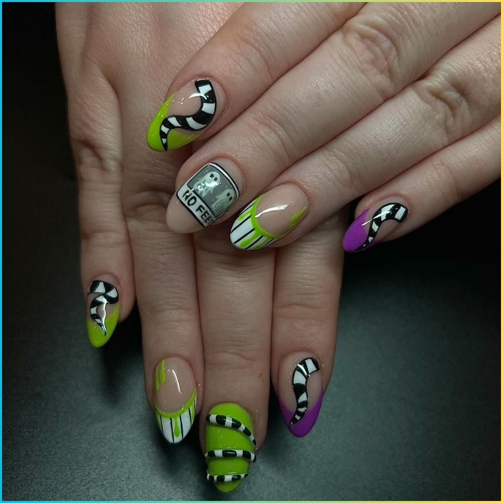 Close up of nails with spooky nails having Beetlejuice Nail Art