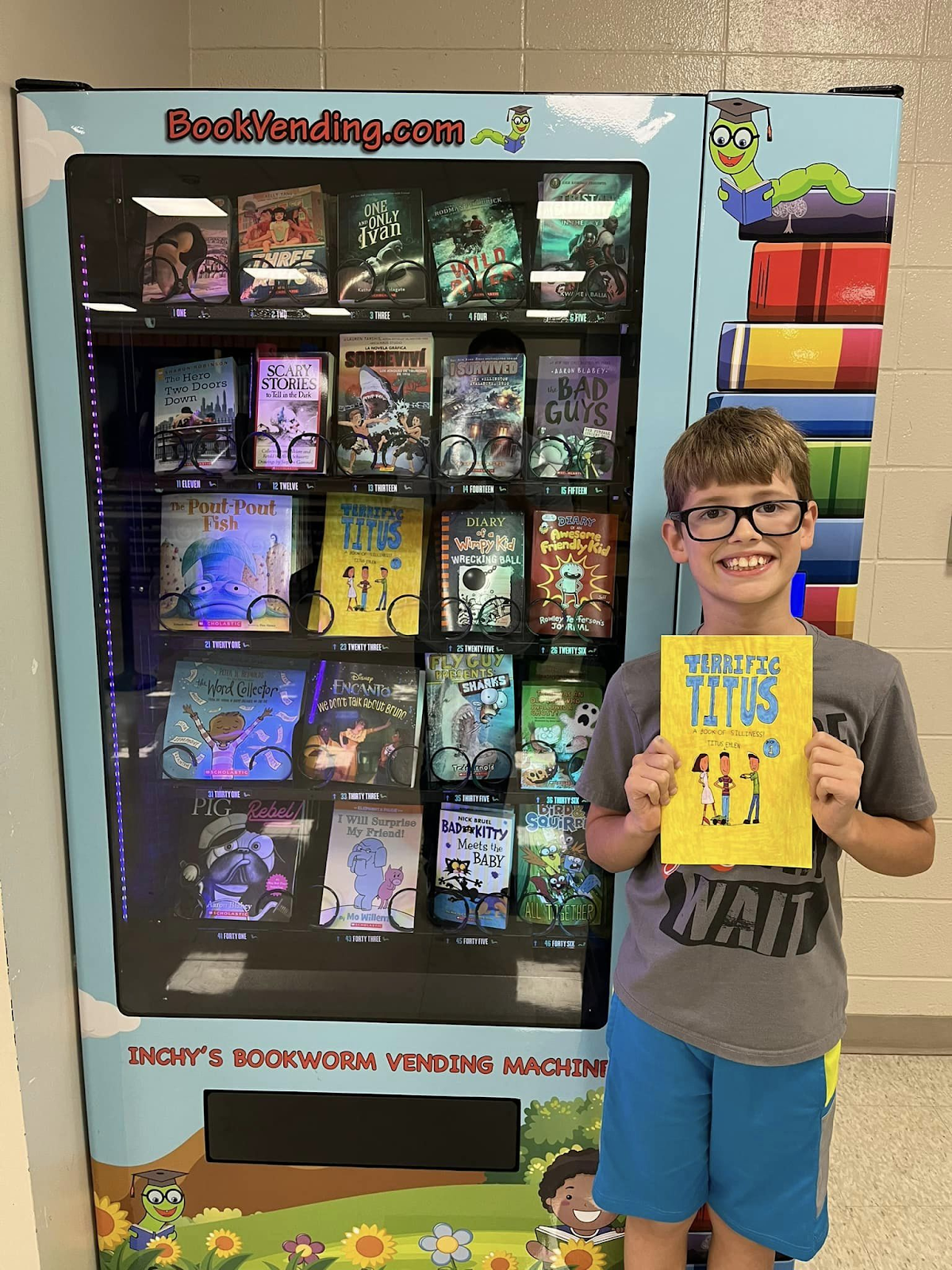 Student & Author Titus Ehlen showing off his book, featured in the school's vending machine