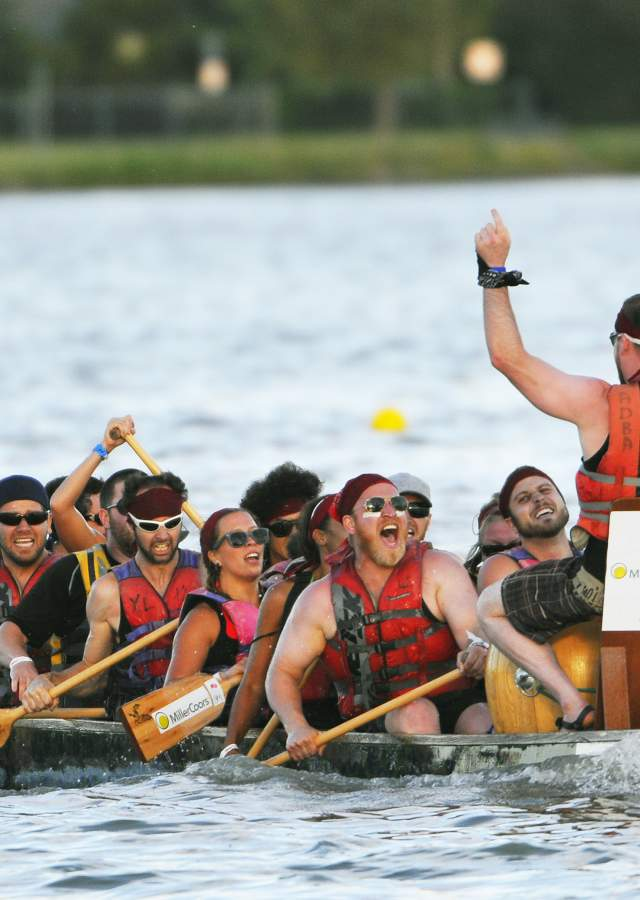 At the heart of the festival, a team charges forward, chasing glory and victory.