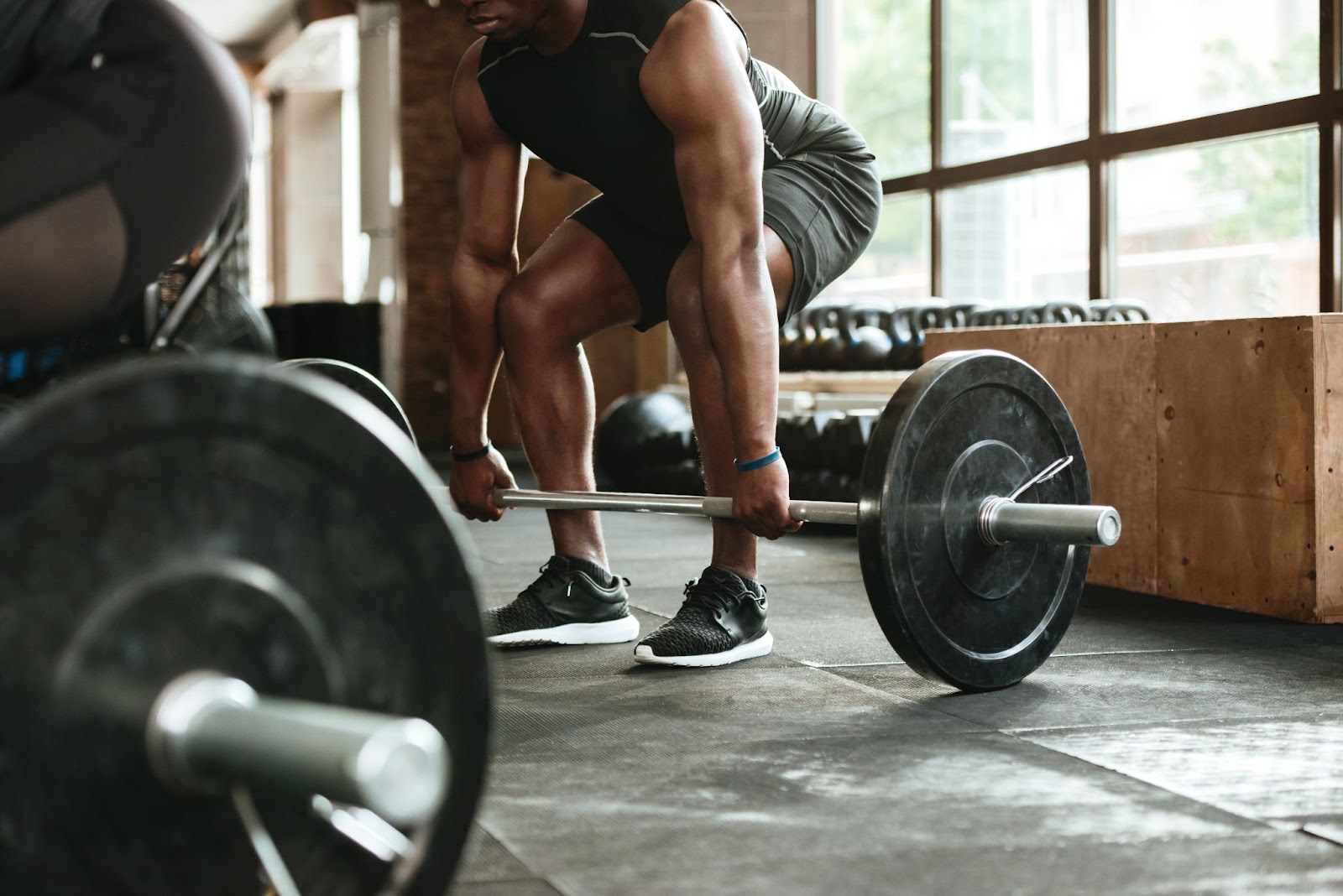 A person lifting a barbell.