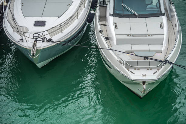 Two boats tied up side by side