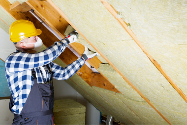 living comfortably factors that influence the cost of insulation in michigan contractor installing new fiberglass panels in attic custom built okemos