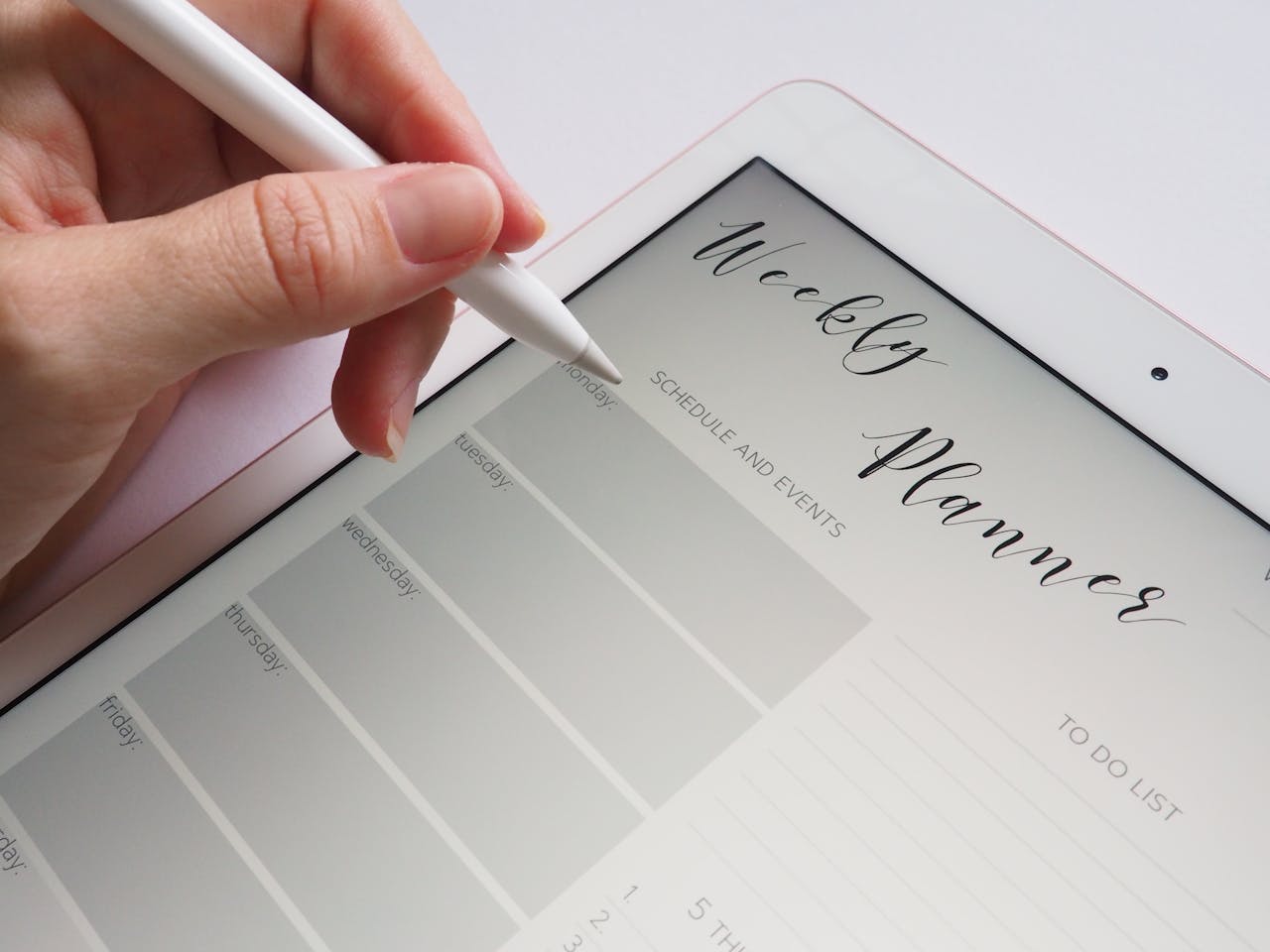 An iPad weekly planner showcasing a clean layout for easy scheduling and task management on the go.