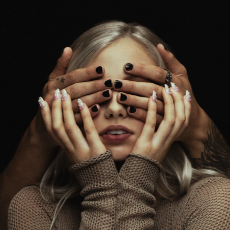 A person covering her face with hands

AI-generated content may be incorrect.