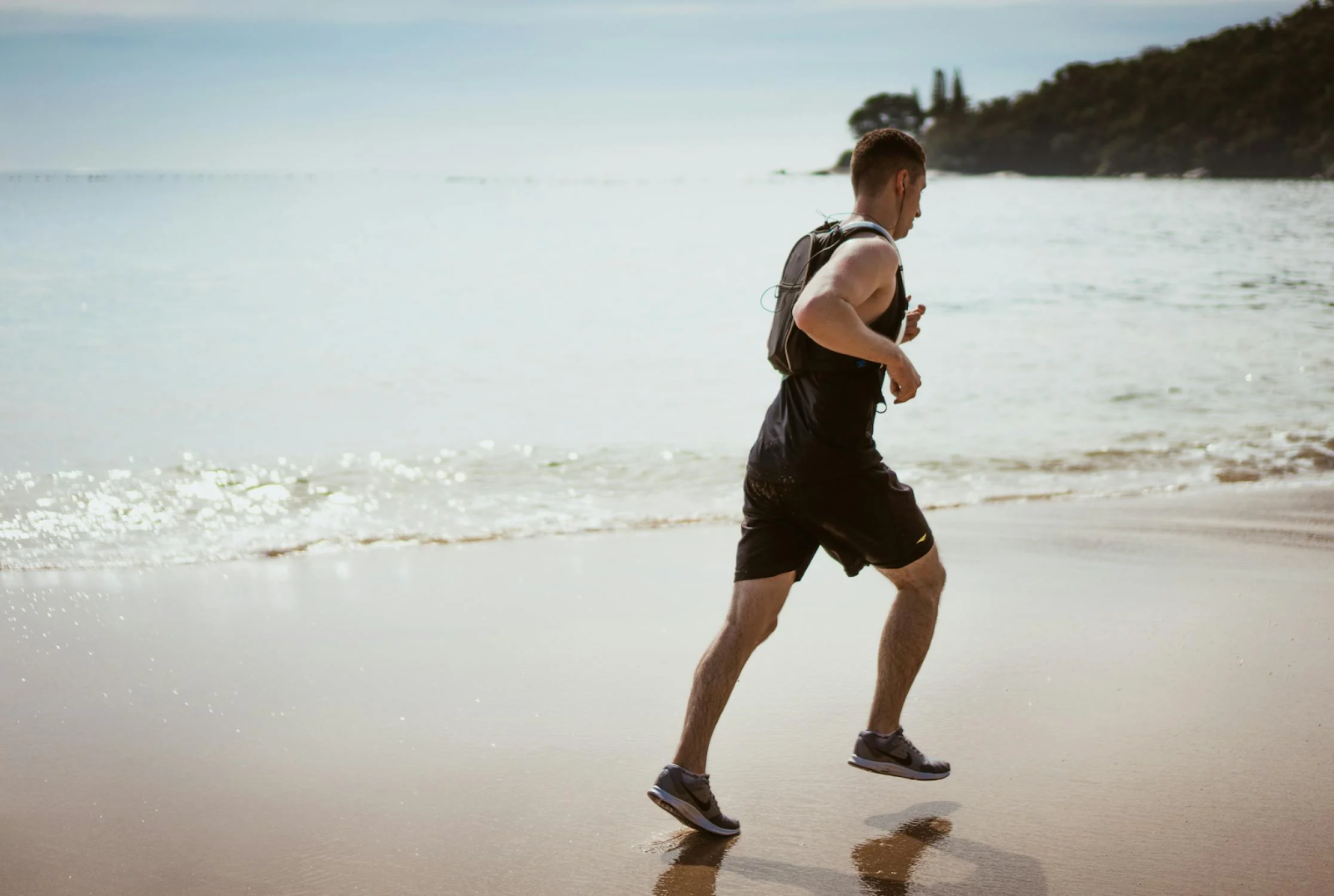 A man running on a beach 