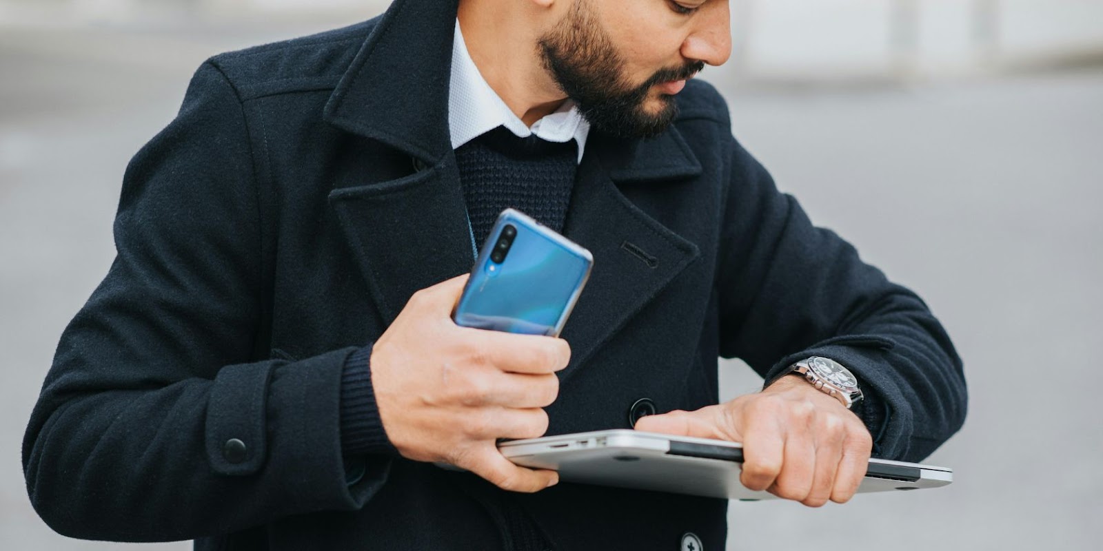 A man checking the time on his watch