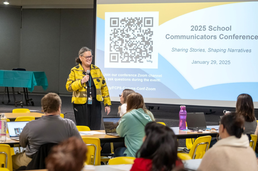 Dr. Reid speaking in front of the 2025 School Communicators Conference. 