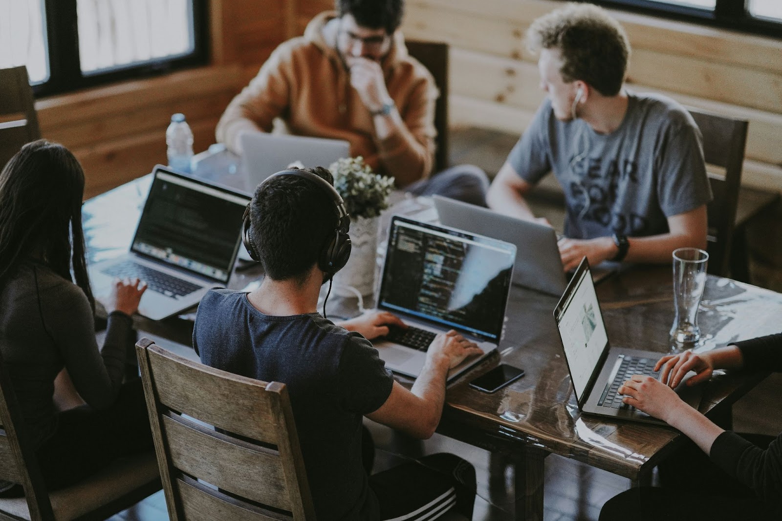 A group of young colleagues working at the same table