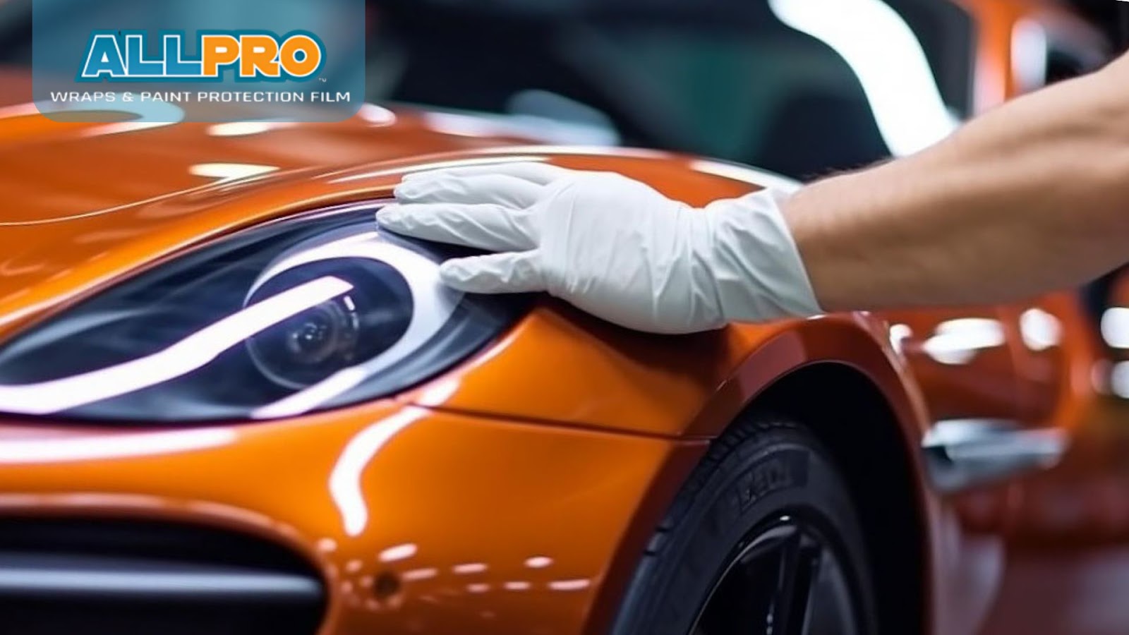 trained technician carefully applying ceramic coating to a car