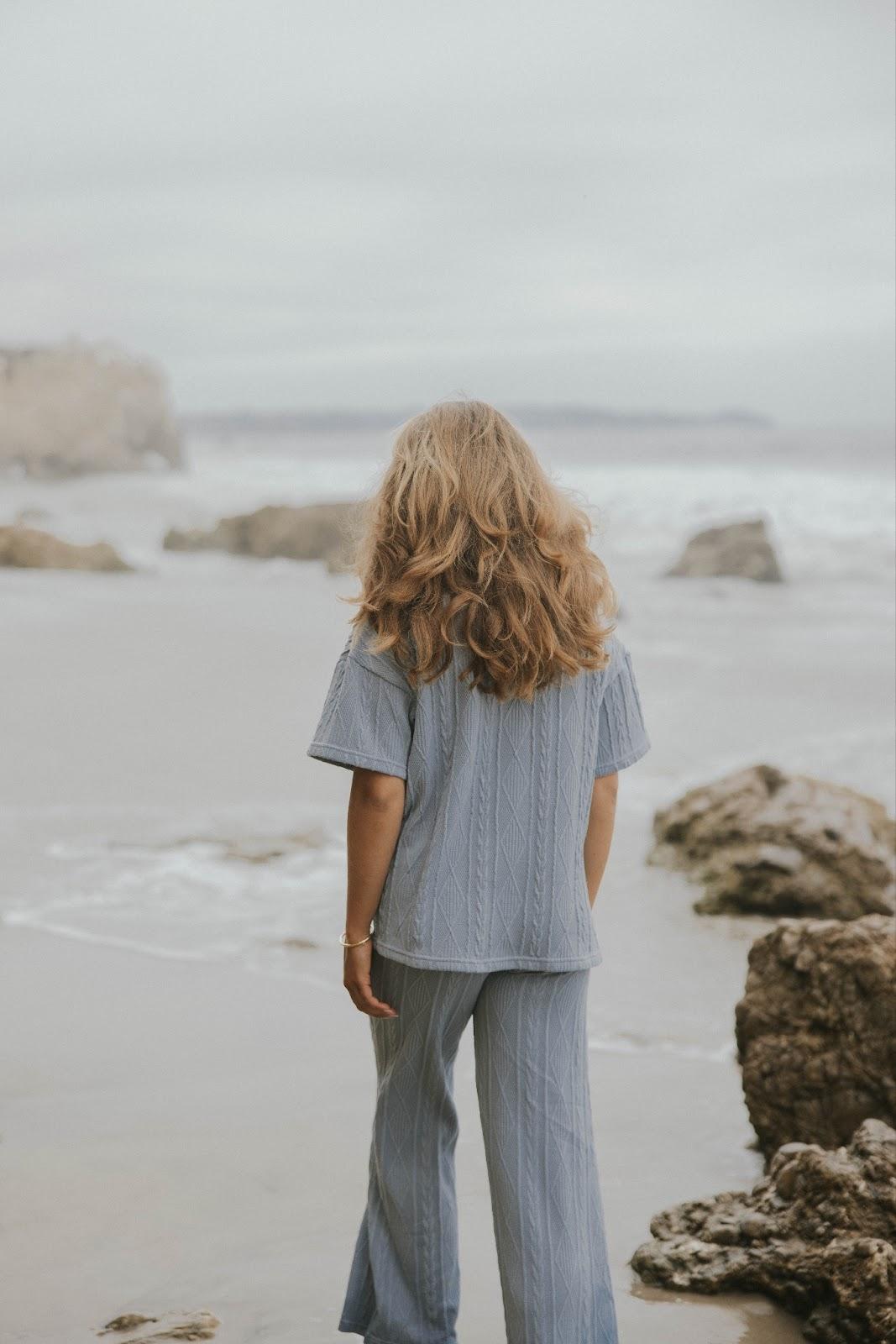 Women's matching cable knit top and pant set.