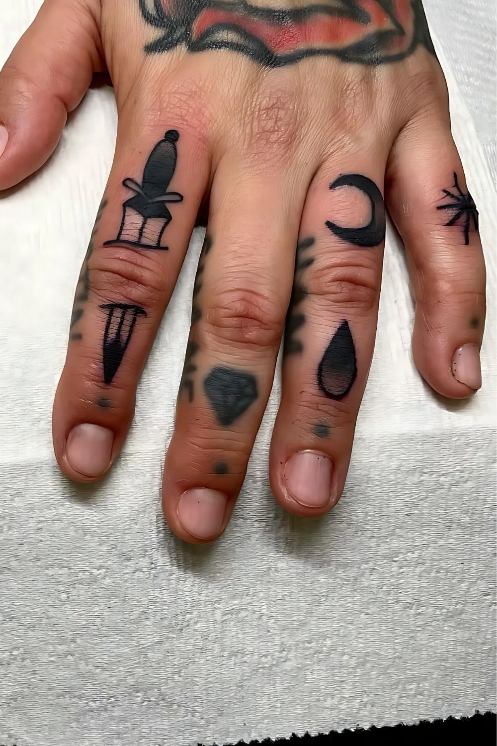 Traditional Finger Tattoo