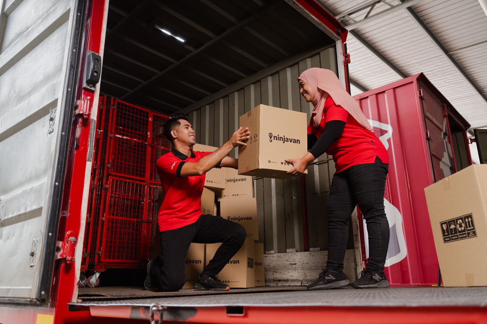 Ninja Van delivery truck loading packed FMCG products for final delivery to customers.