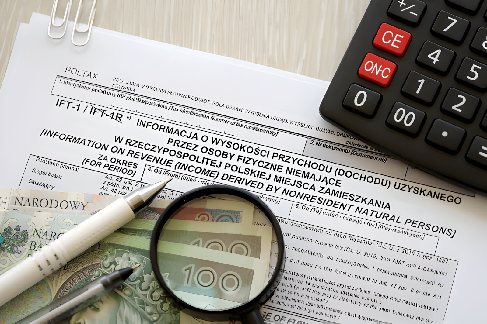 Documents and tools used by accountants to handle international tax issues, including tax forms, a calculator, currency notes, and a magnifying glass.