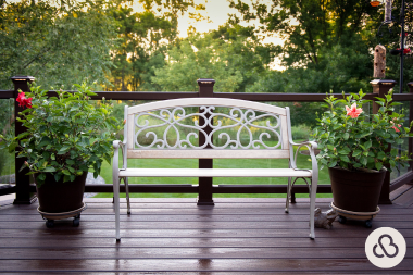 when to hire a michigan deck installer white park bench on dark trex composite decking with potted flowers custom built okemos