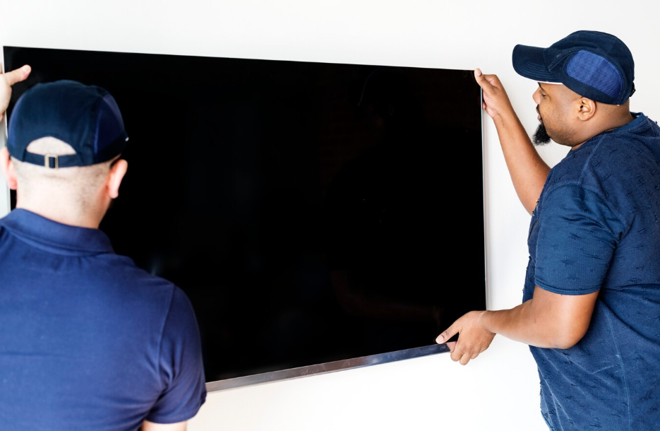 A person pointing at a black screen  AI-generated content may be incorrect.