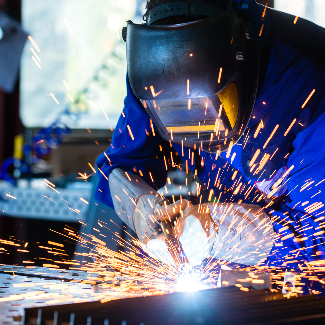 Person wearing mask and welding