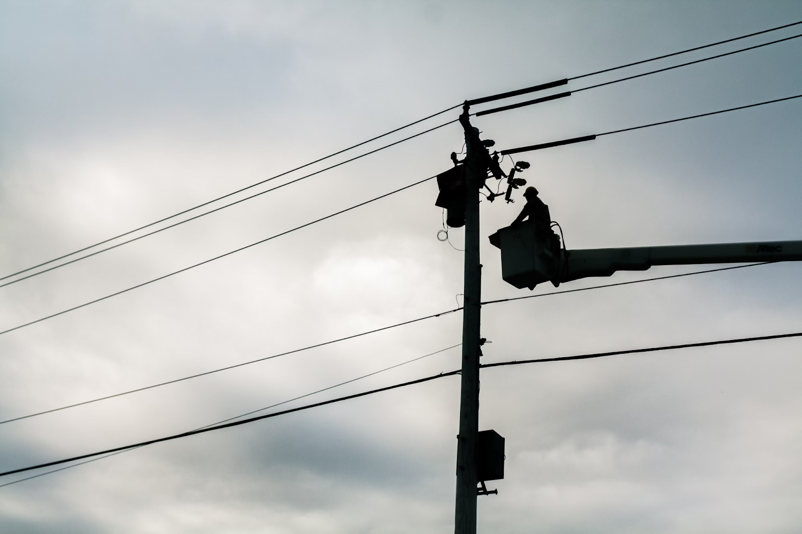 Silhouette of a street lamp during daytime. 