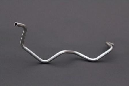 A metal curved object on a grey surface

Description automatically generated