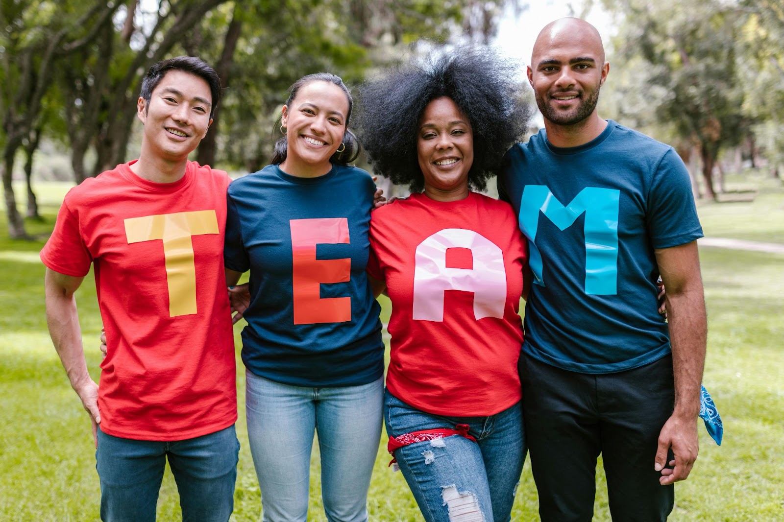 A team of four people posing for a photo