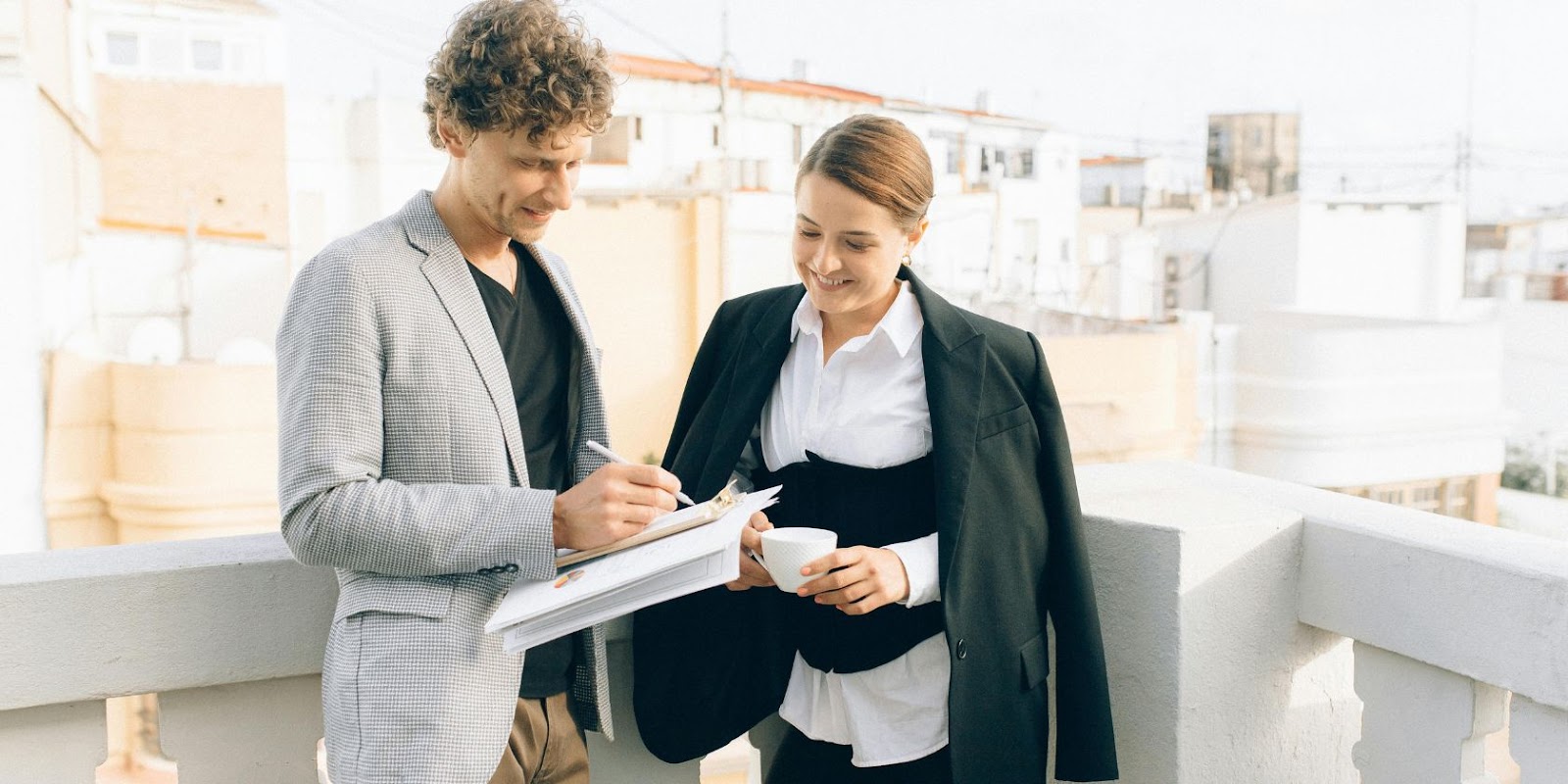 Two business people standing beside each other