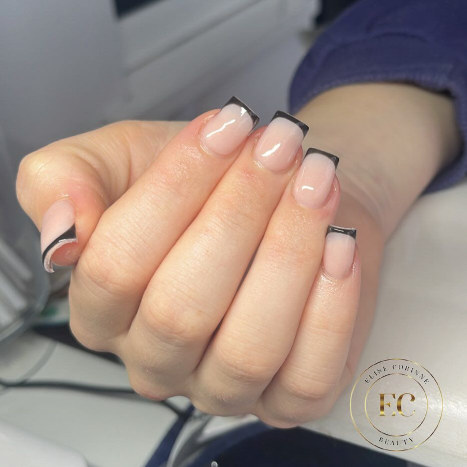 Close-up of a person's hands with black nails having Black Tips with Glossy Topcoat