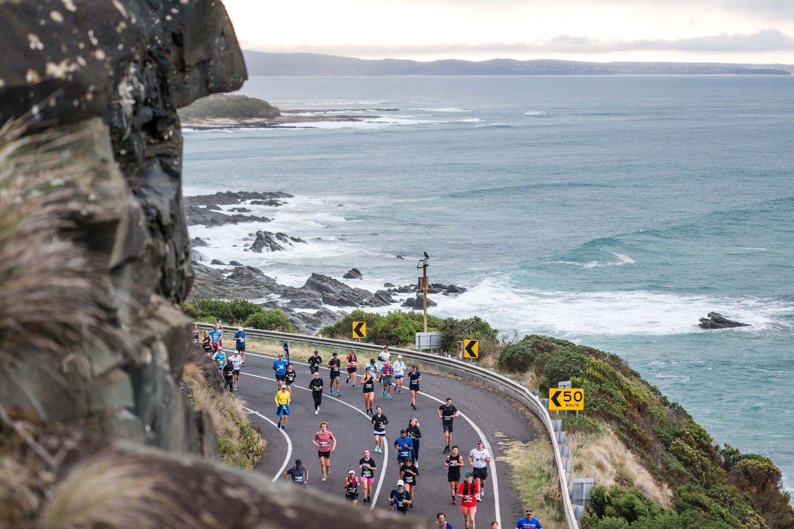 Great Ocean Road Running Festival racers run along the Great Ocean Road.