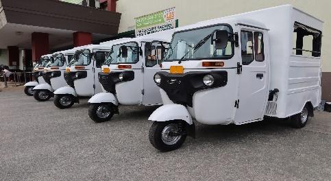 A row of white vehicles