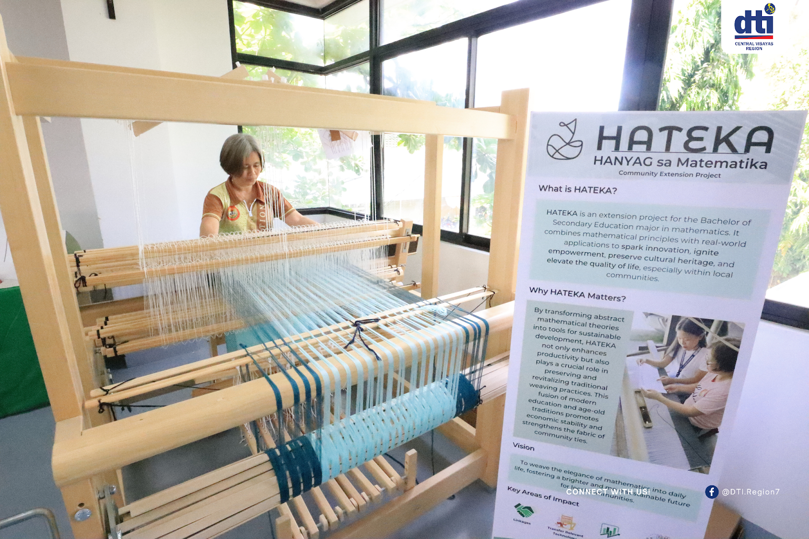 A person operating a handloom weaving machine in Argao, Cebu, with a poster about the HATEKA (HANYAG sa Matematika) project in the foreground, highlighting the integration of mathematics into traditional weaving practices.