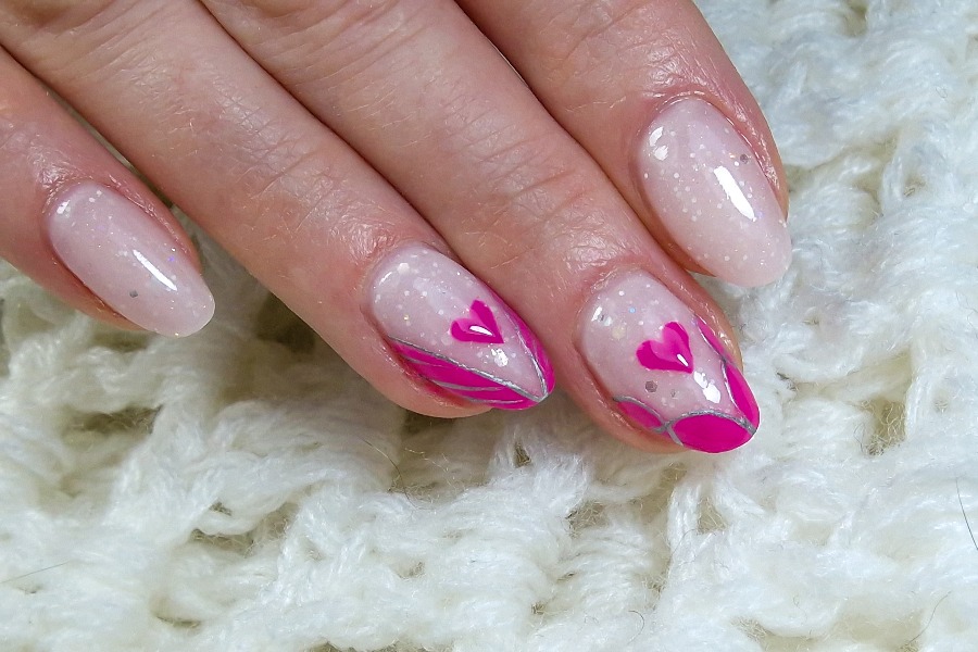 Heart-tipped nails give a romantic update to the timeless French nail tip design.