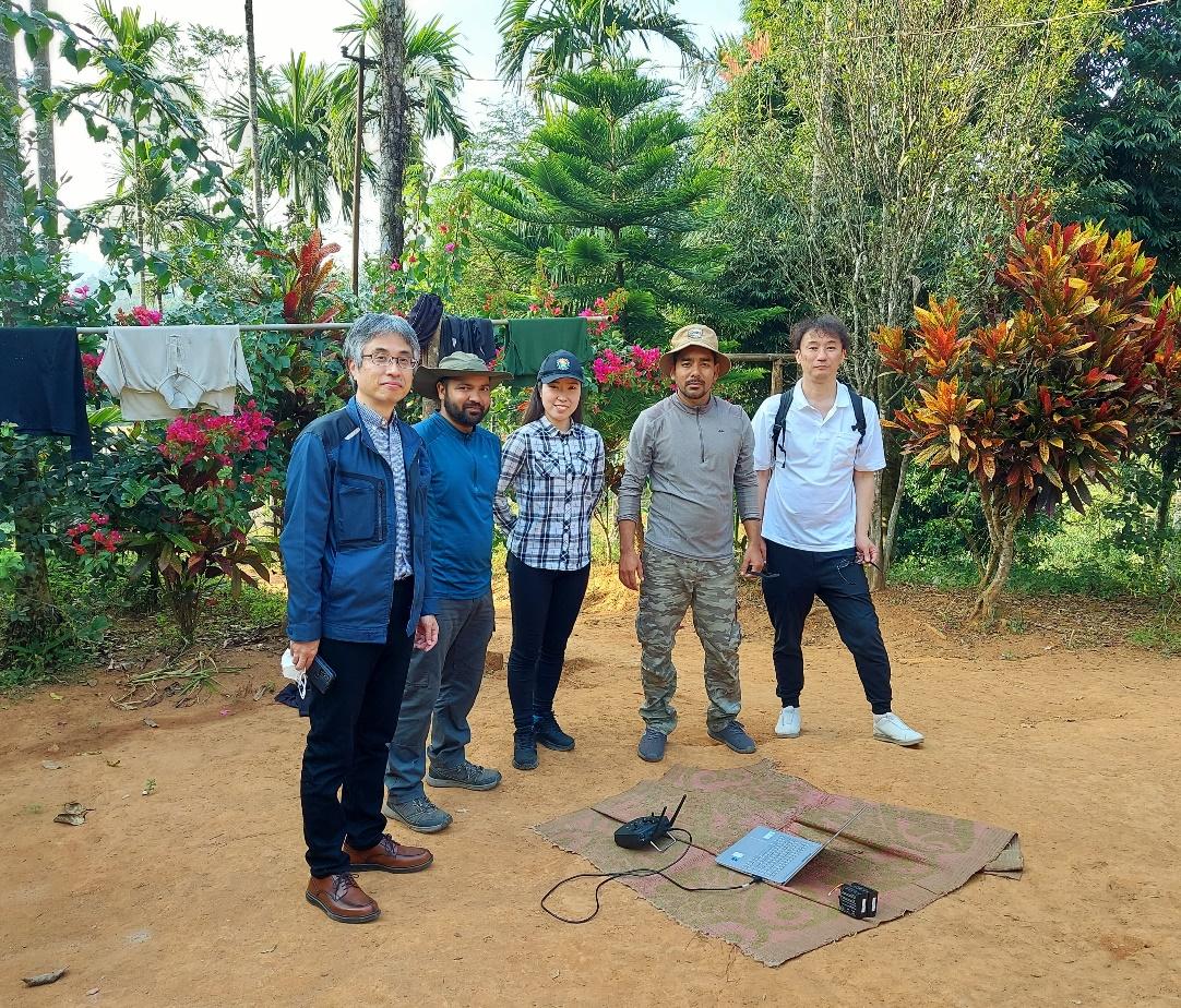 A group of people standing in a field

AI-generated content may be incorrect.