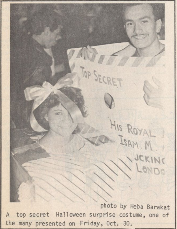 Photo of a student dressed as a piece of mail labelled "Top Secret" and another student dressed as a present.