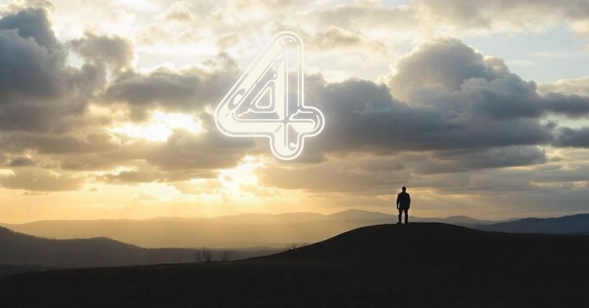 A person stands atop a hill, gazing at the sky where the number 4 appears, symbolizing the Meaning of Number 4 in the Bible.