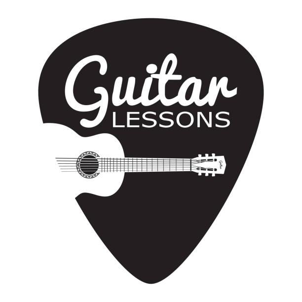 A guitar pick with a white and black backgroundDescription automatically generated