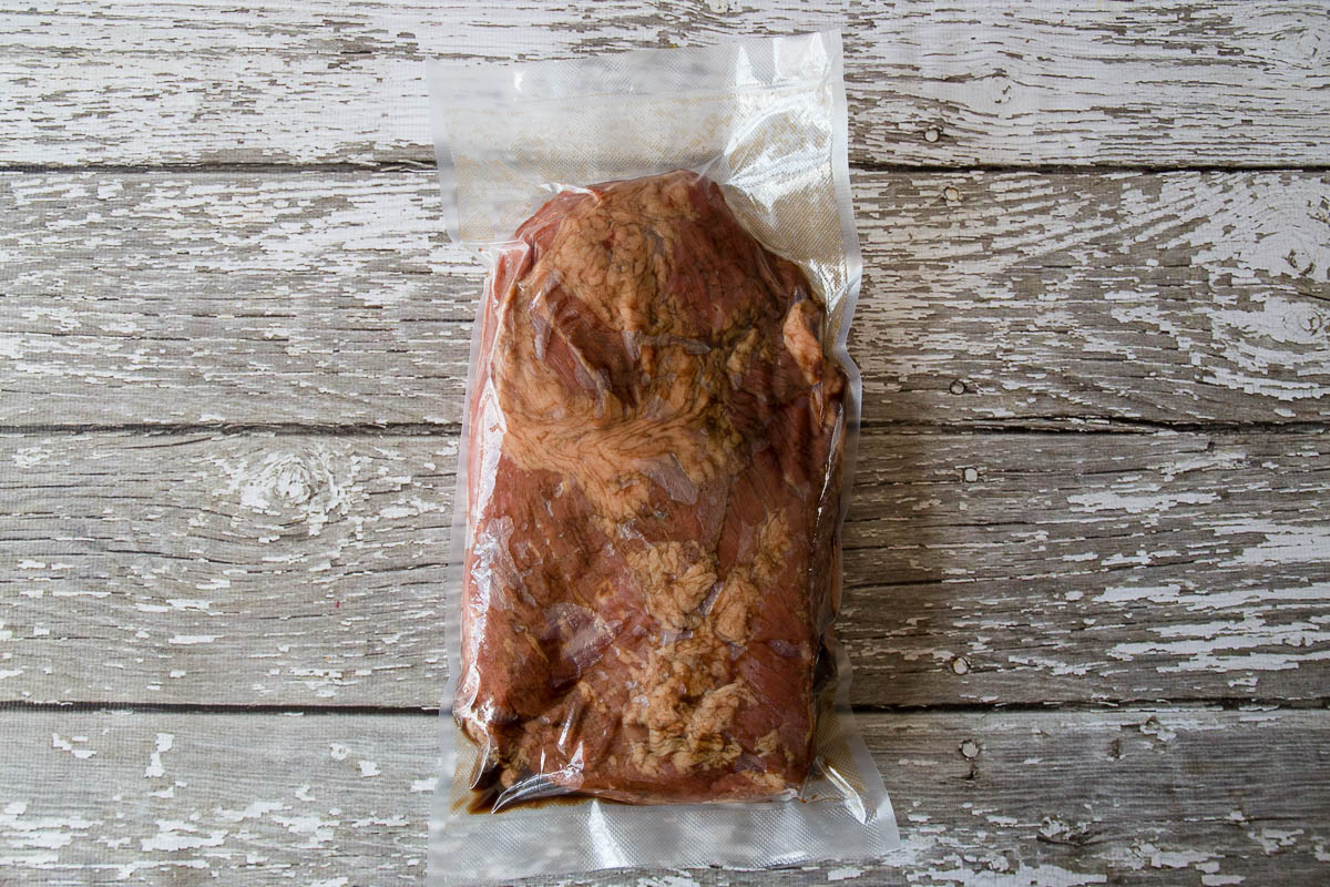 Vacuum sealed beef brisket with marinade