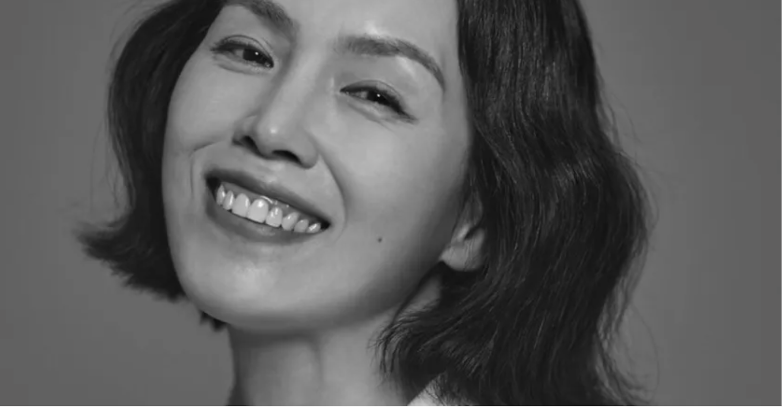 A black and white picture of  Park Ji Ah smiling