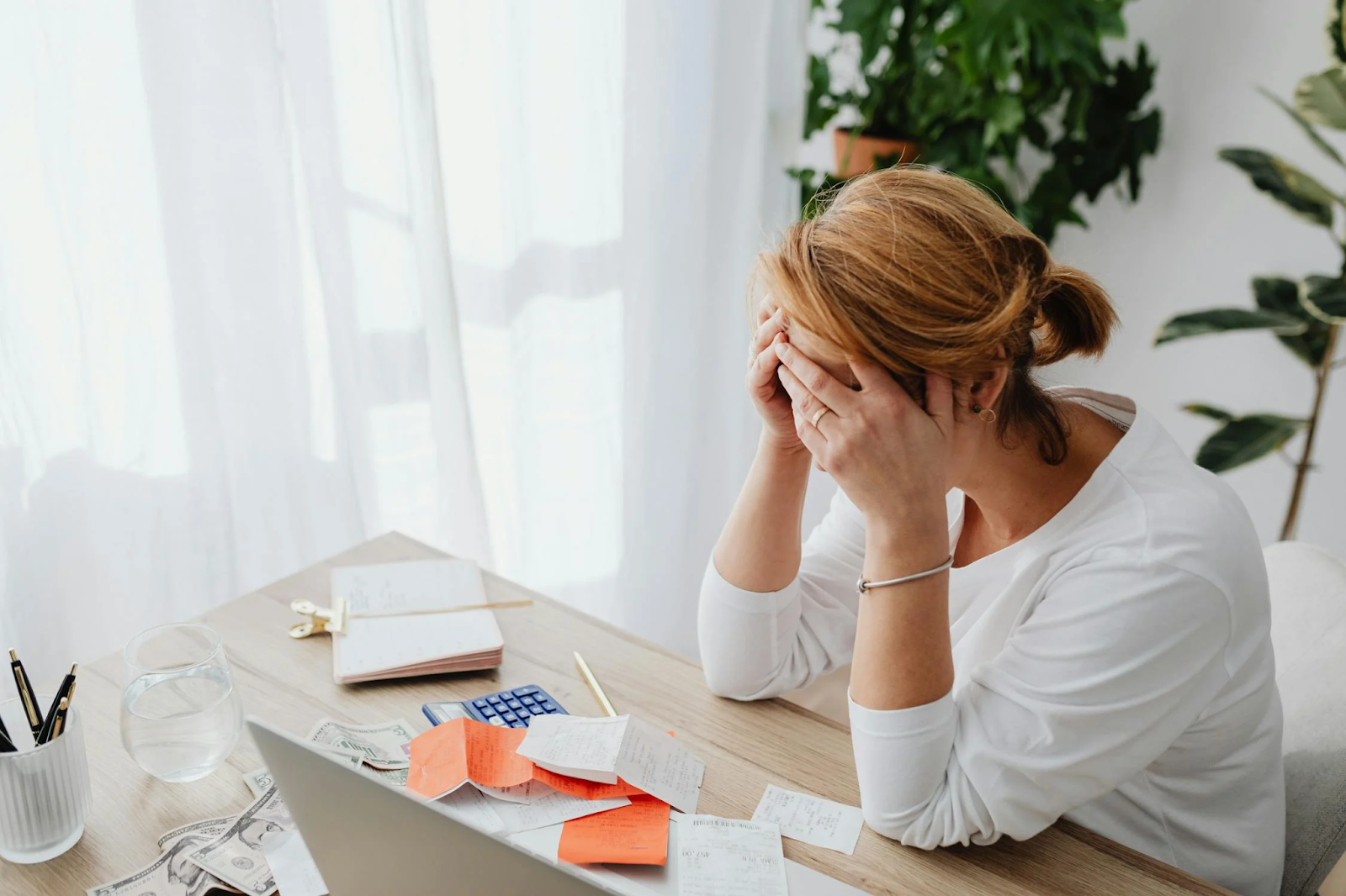 A woman stressing over money 