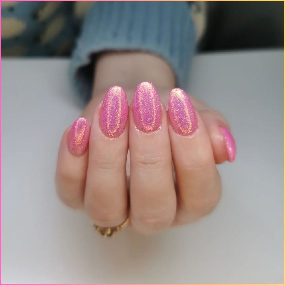 Close up of nails with simple pink nail designs having Pink Glitter Nails