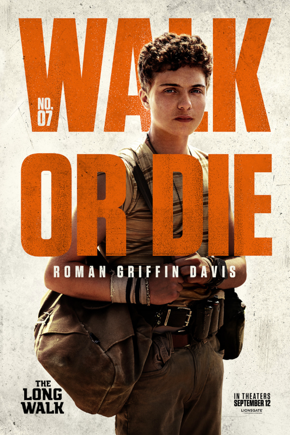 A person in military uniform with orange textDescription automatically generated