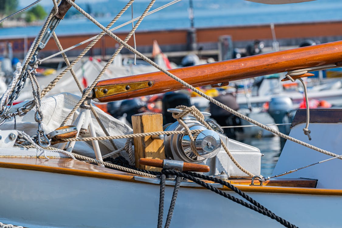 Free Detailed view of sailboat rigging and ropes at a marina dock. Stock Photo